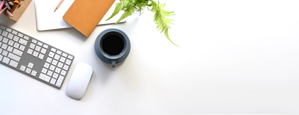 Image of keyboard, mouse and coffee cup.